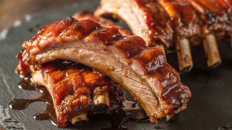 Pork ribs covered in barbecue sauce