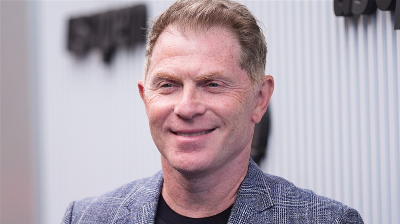 Bobby Flay smiling at an event