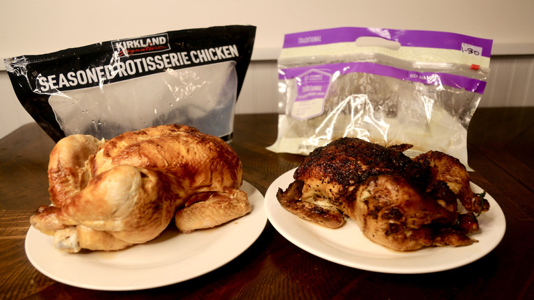 Two rotisserie chickens on plates with bag behind