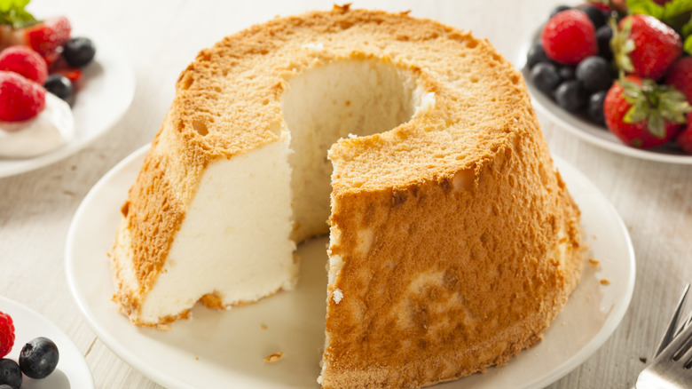 Angel food cake on a plate with berries
