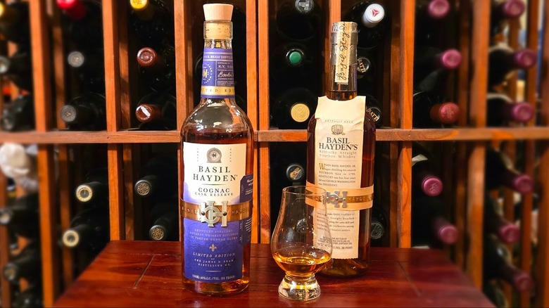 Bottle of Basil Hayden Cognac Cask Bourbon and Basil Hayden Bourbon with glass
