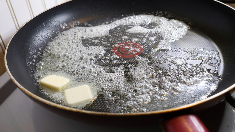 butter melting in skillet