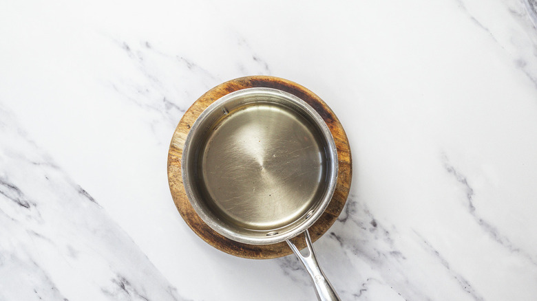Saucepan with simple syrup.