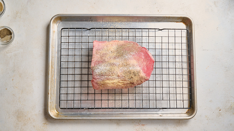 beef roast seasoned with salt and pepper