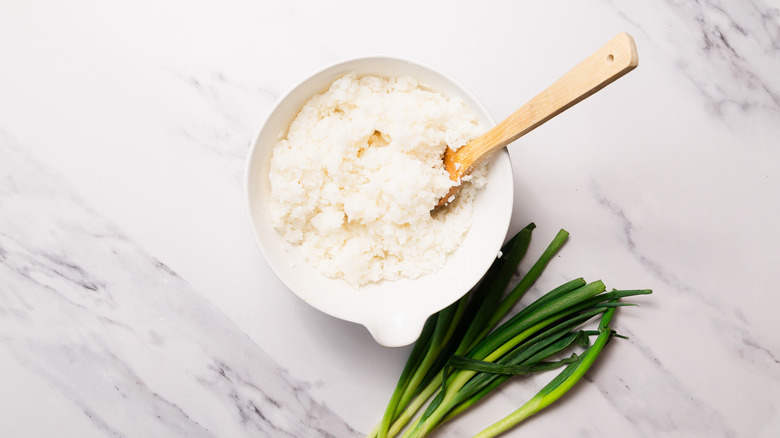 rice and wooden spoon in bowl