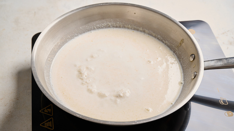 thickening milk in a skillet