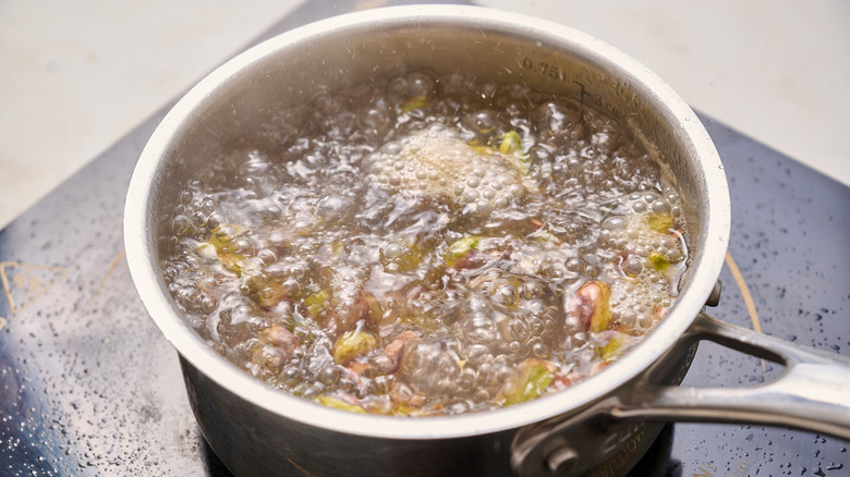 boiling pistachios in a saucepan