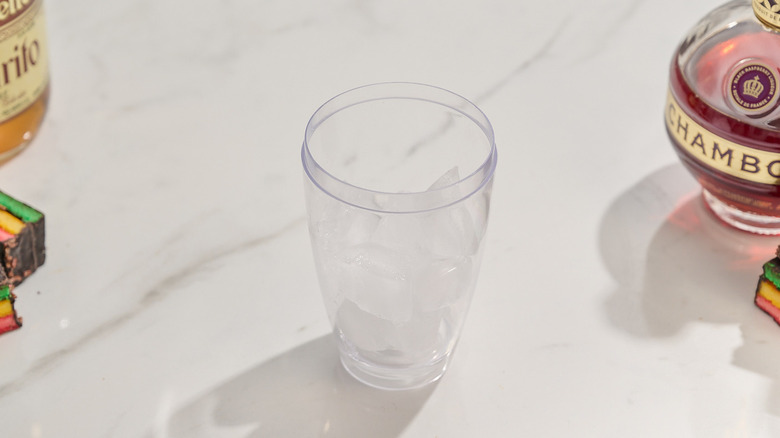 cocktail shaker filled with ice on a table