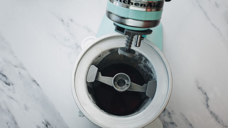 Ice cream machine with the liquid ingredients for a Manhattan cocktail.