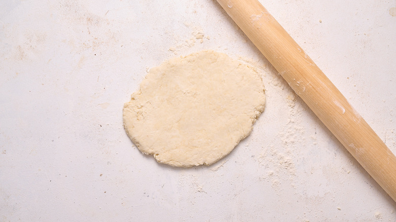 rolling the dough out with rolling pin