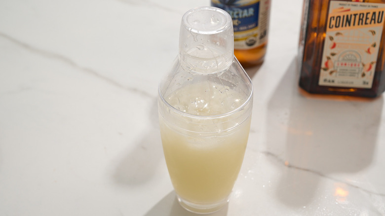 shaken margarita in shaker on table
