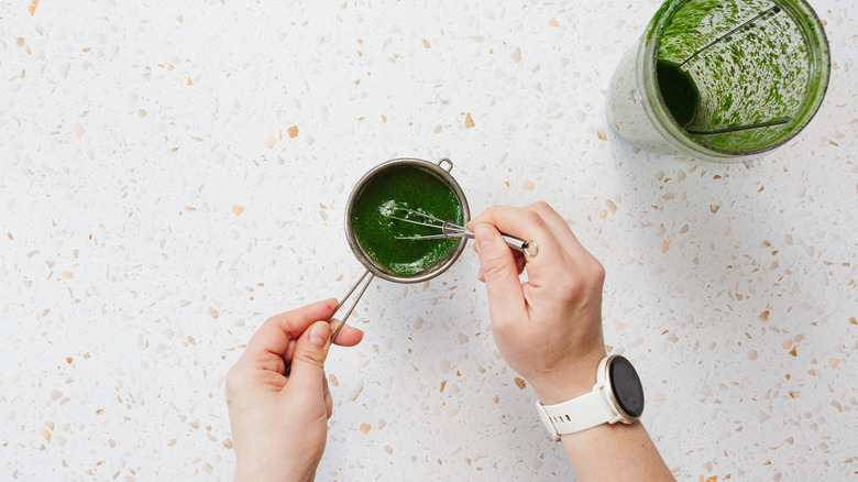Straining basil oil