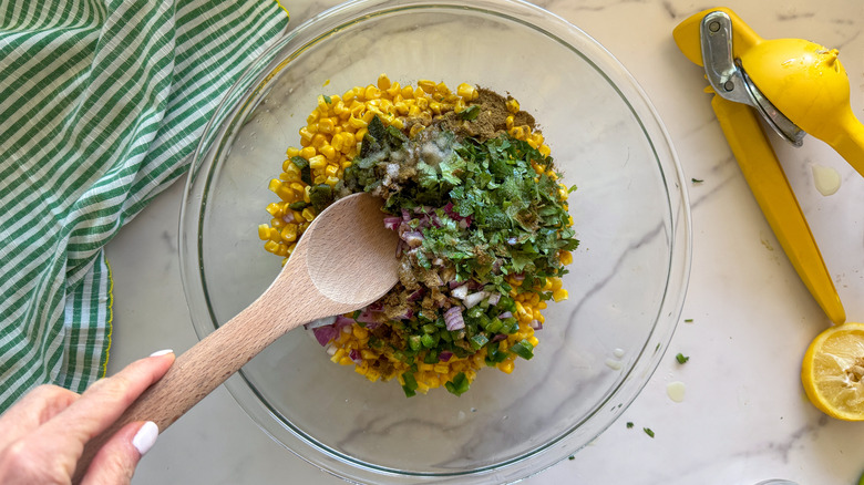 hand stirring salsa