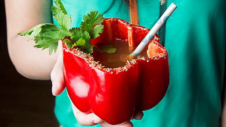 Spicy cocktail served in hollowed out red bell pepper