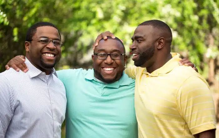 Joyful moment of three brothers sharing a laugh