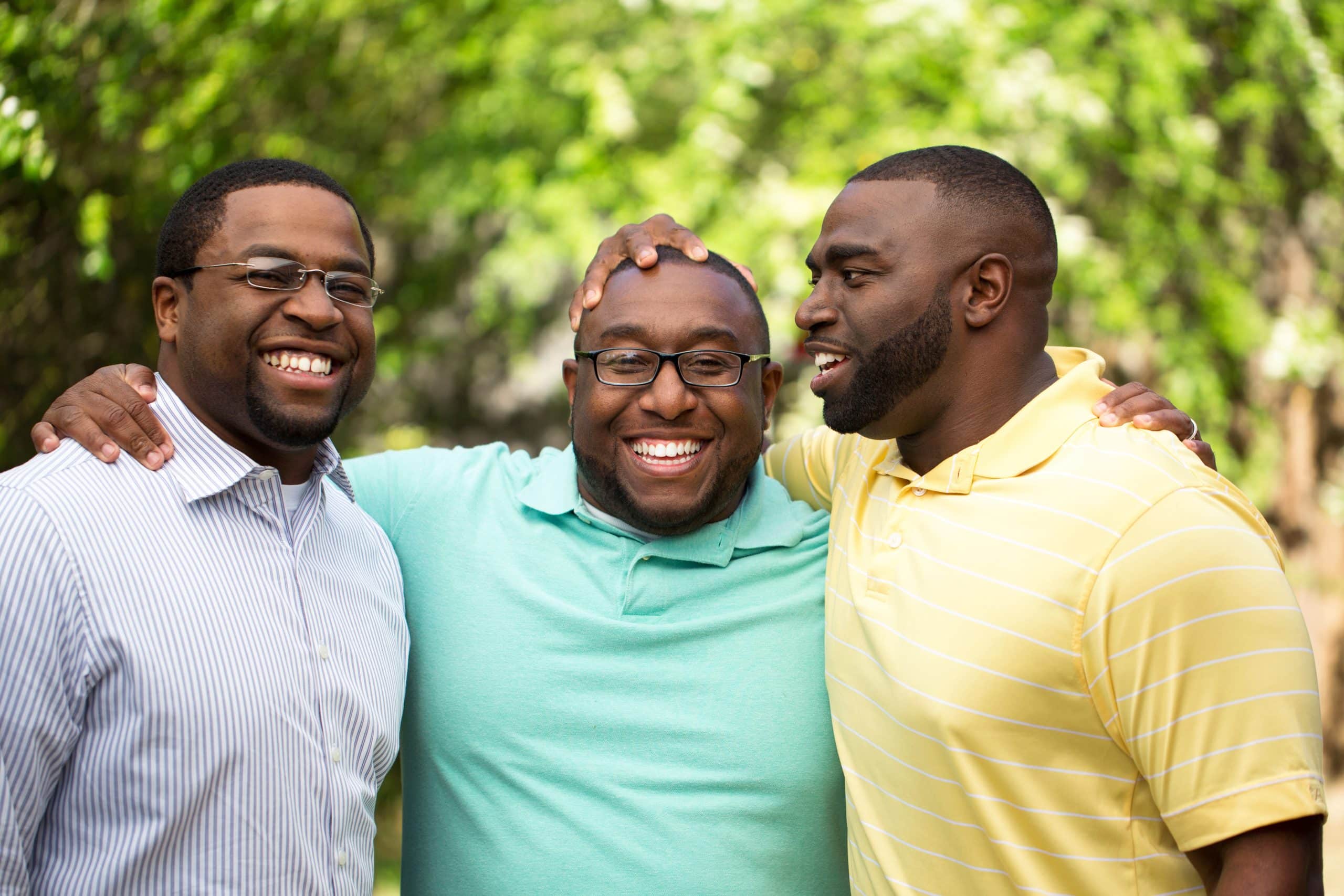 Joyful moment of three brothers sharing a laugh