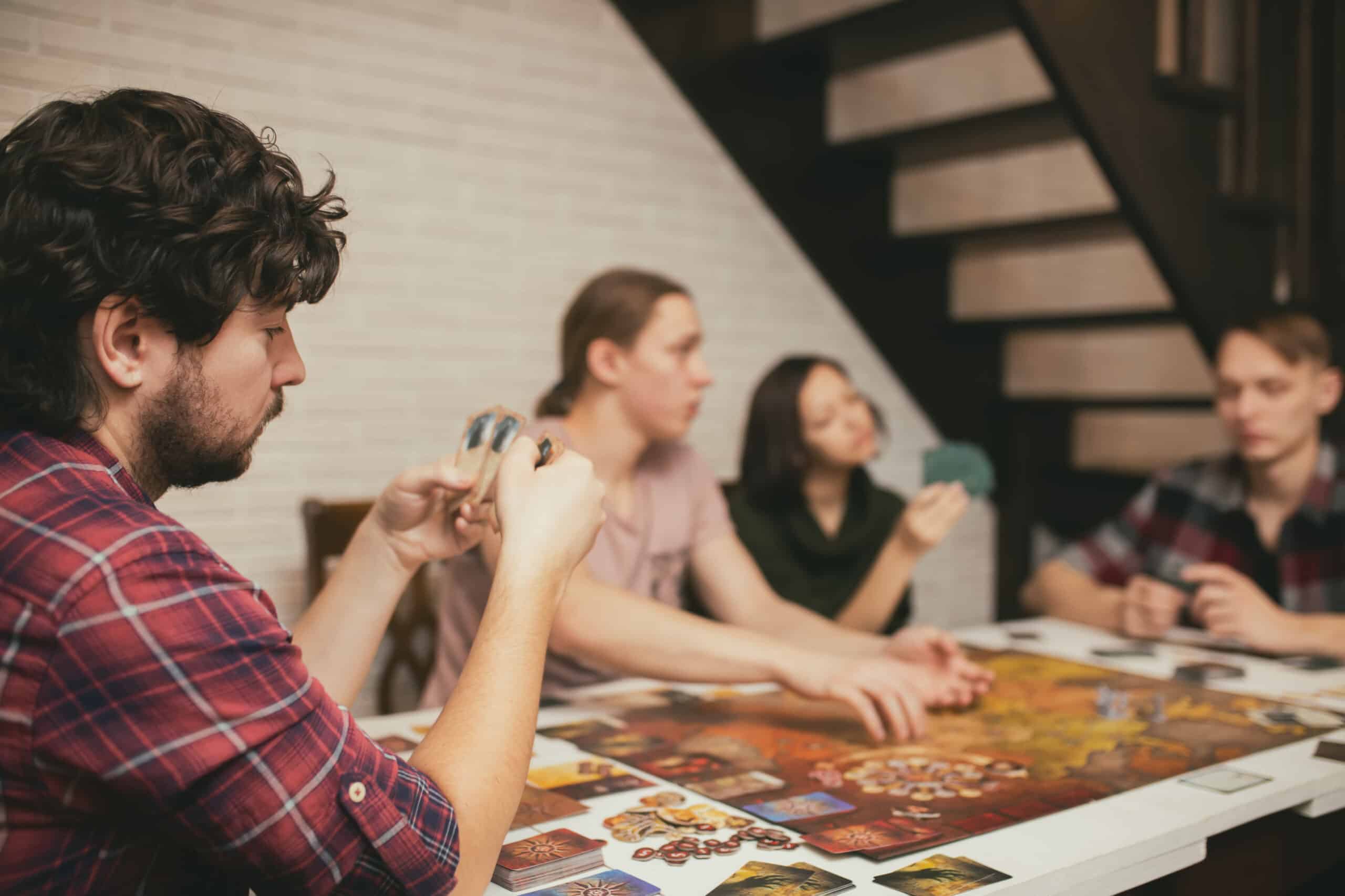 Group of friends playing a board game together