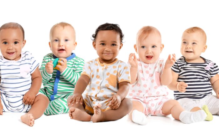 Babies sitting and smiling