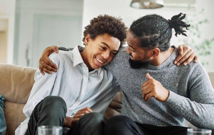 People hugging and smiling, showing affection and happiness
