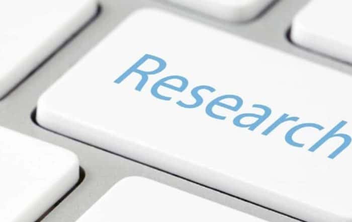 Close-up of a keyboard with the word "Research" on it