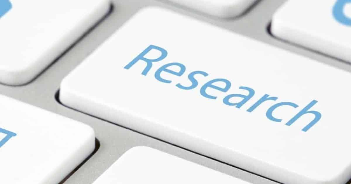 Close-up of a keyboard with the word "Research" on it