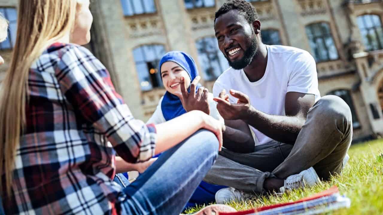 Group of people chatting and relaxing in a park