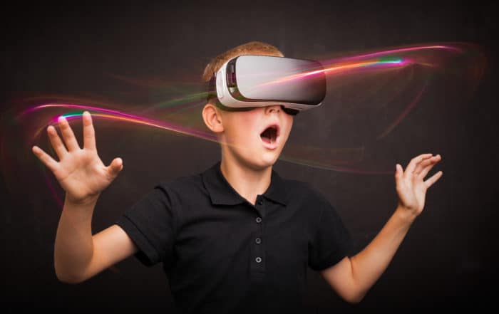 Child experiencing virtual reality with VR goggles