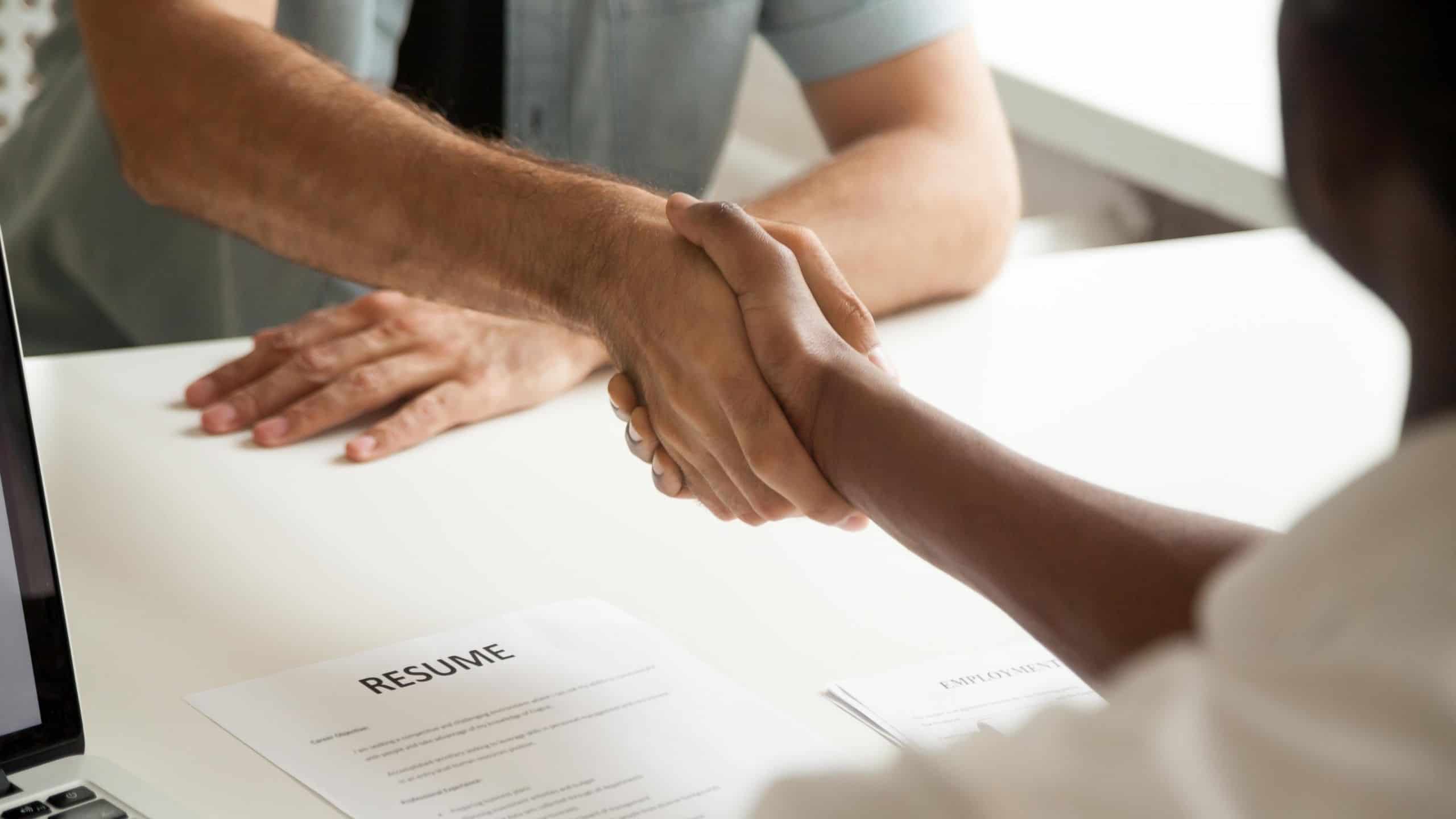 Professional handshake between two men following a job interview